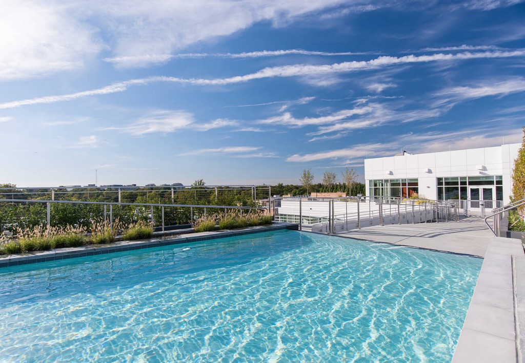 Cool off with a dip in the rooftop swimming pool and  infinity spillway